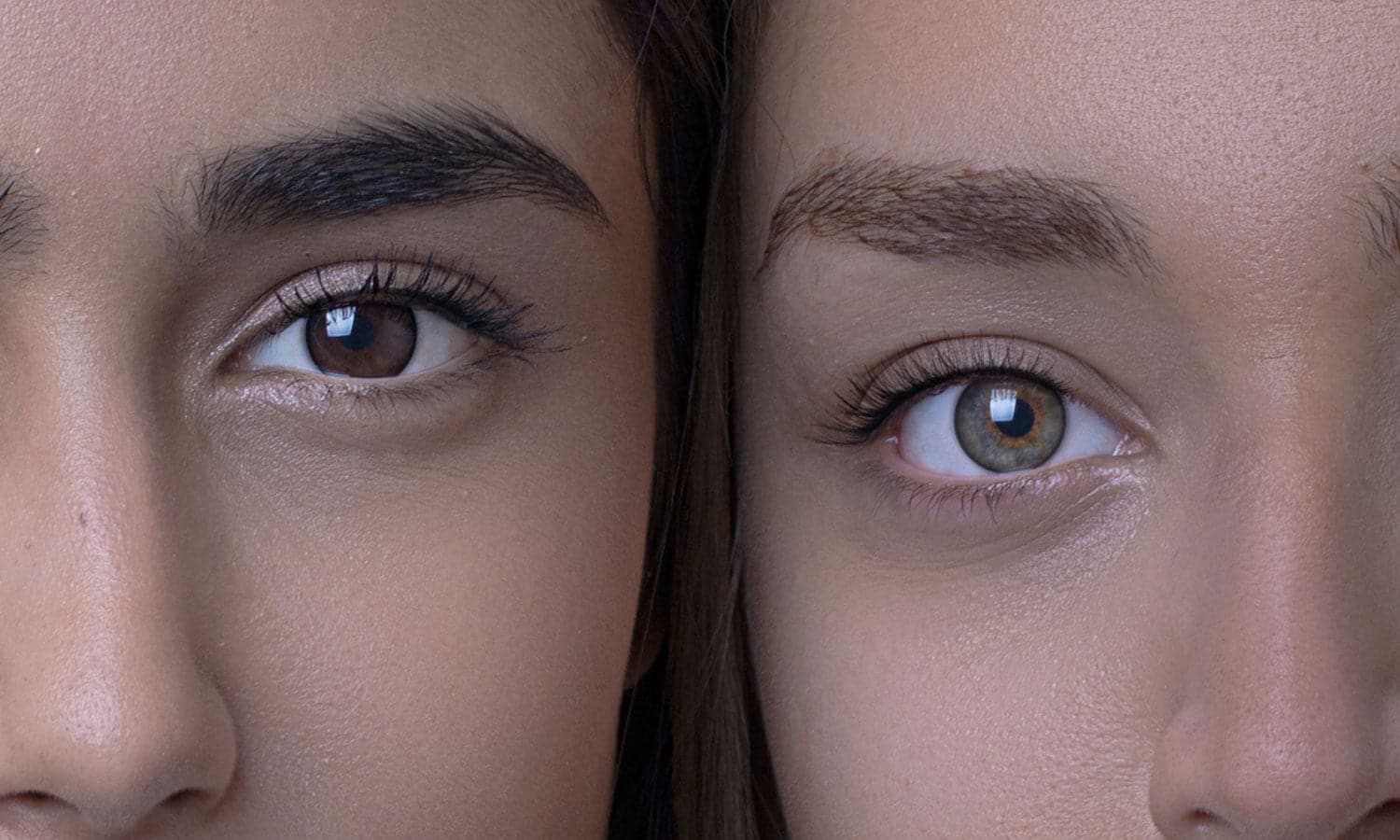 Up-close shot of two people, each with one of their eyes in focus.
