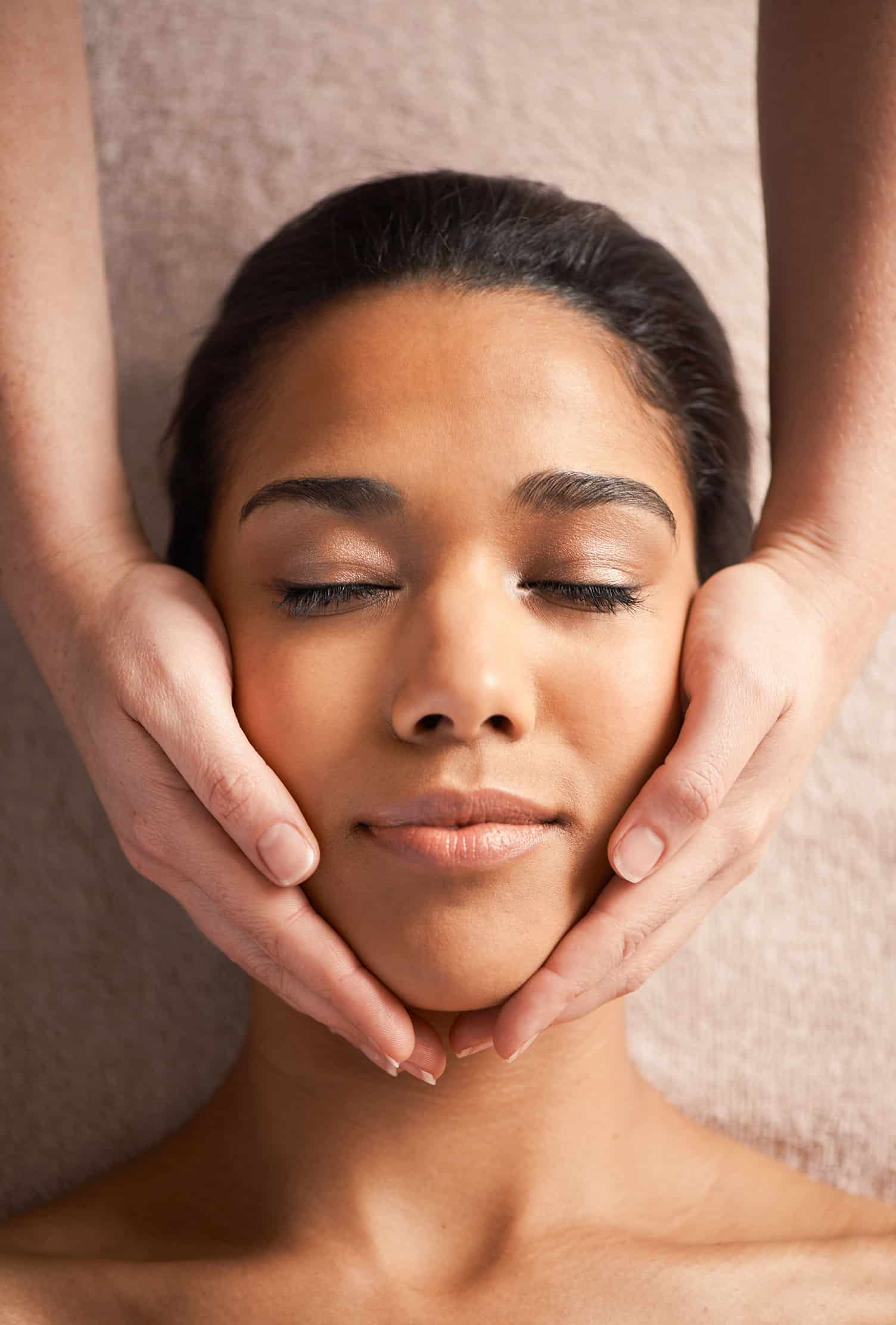 Client receiving a relaxing facial treatment