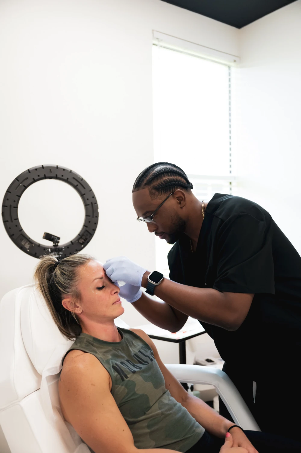 Provider treating a patient during an injectables appointment